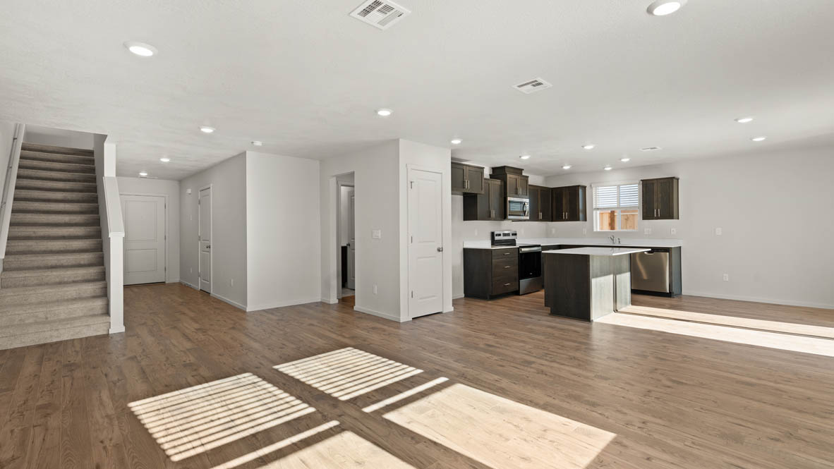 Addysen Park Entry with carpeted stairs, laminate flooring, and white walls