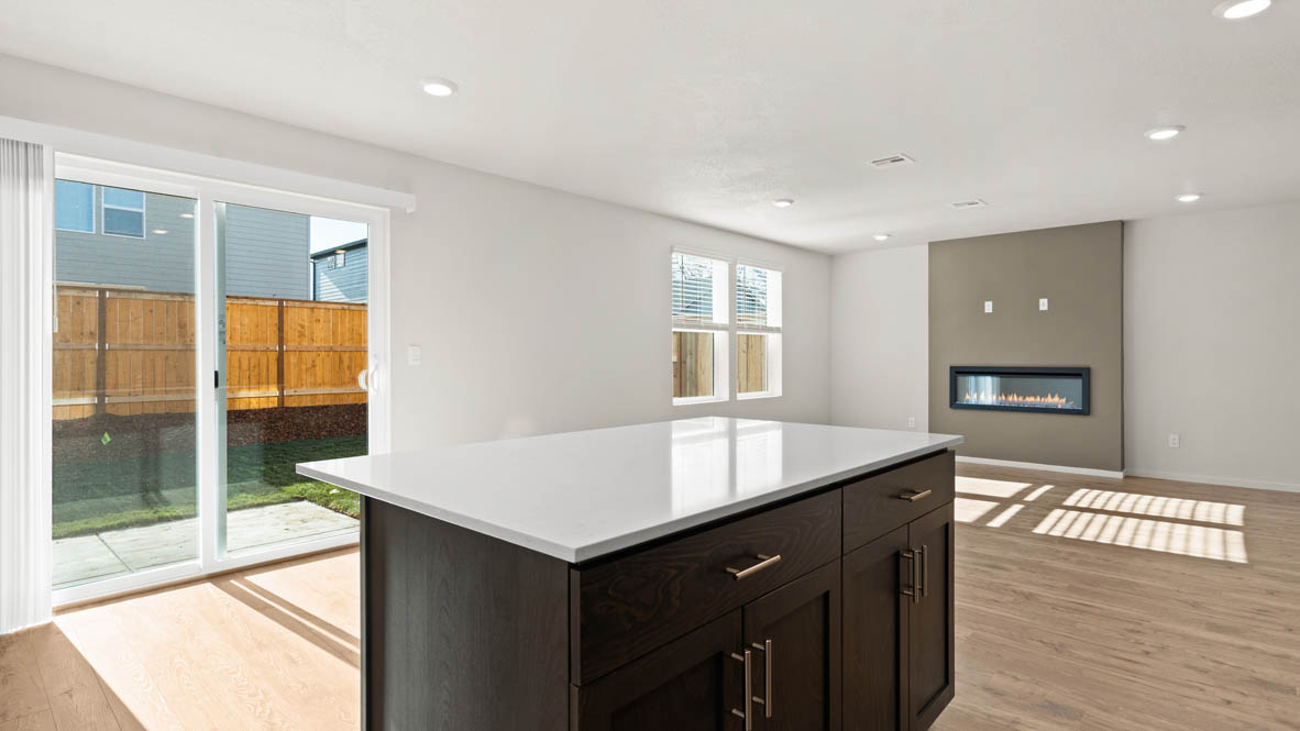 Addysen Park kitchen with laminate flooring, stainless steel appliances, cabinets, window, solid surface countertops
