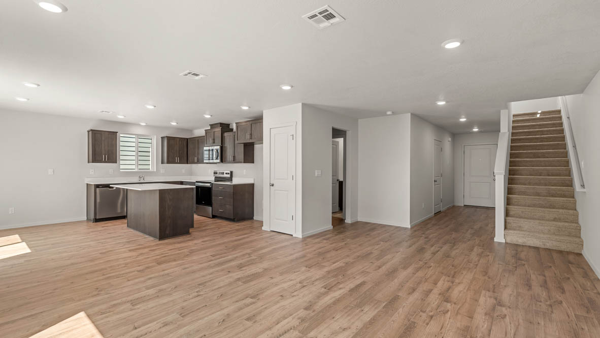 Addysen Park Entry with carpeted stairs, laminate flooring, and white walls
