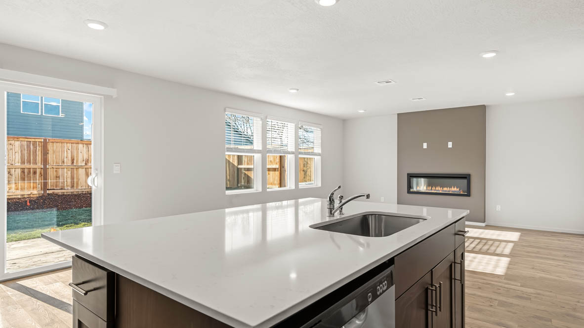 Addysen Park great room and Kitchen with flooring, stainless steel appliances, quartz countertops