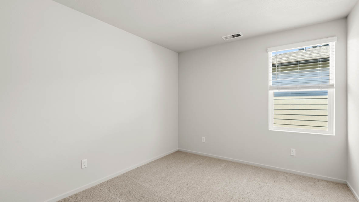 Addysen Park Bedroom with carpet, white walls, and window