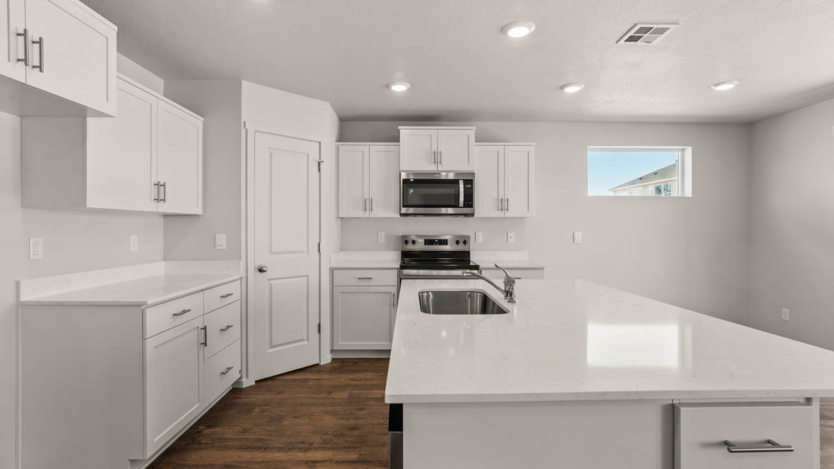 Addysen Park Kitchen with flooring, stainless steel appliances, quartz countertops