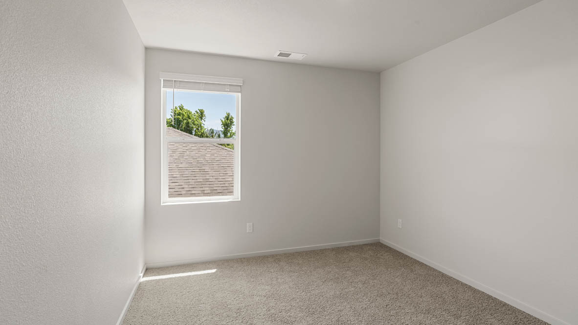 Addysen Park Bedroom with carpet, white walls, and window