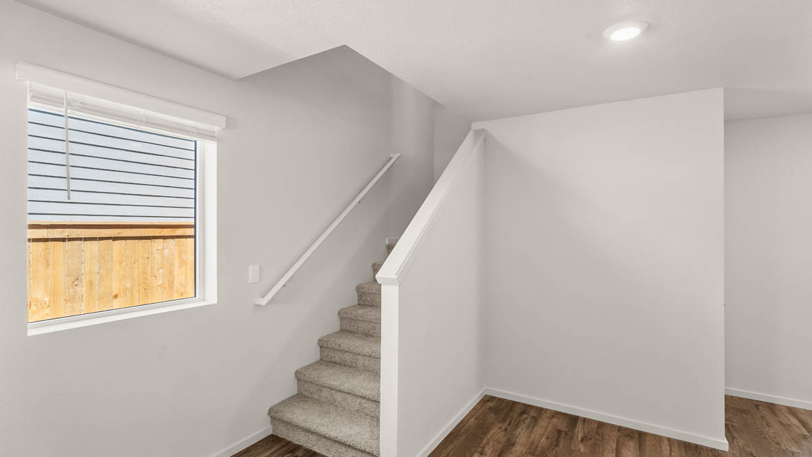 Addysen Park Entry with a staircase, white walls and laminate flooring