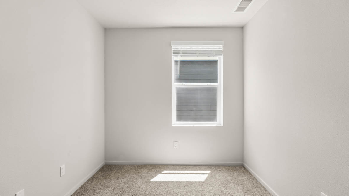 Addysen Park Den with carpet, a window, and white walls