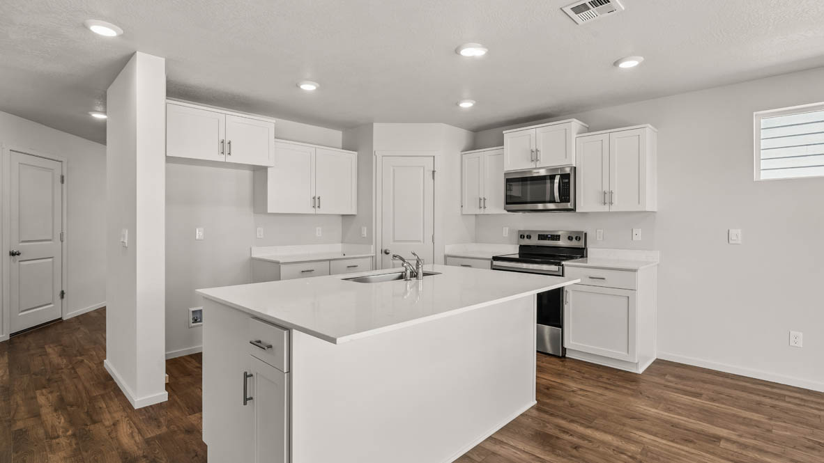 Addysen Park Kitchen with flooring, stainless steel appliances, quartz countertops