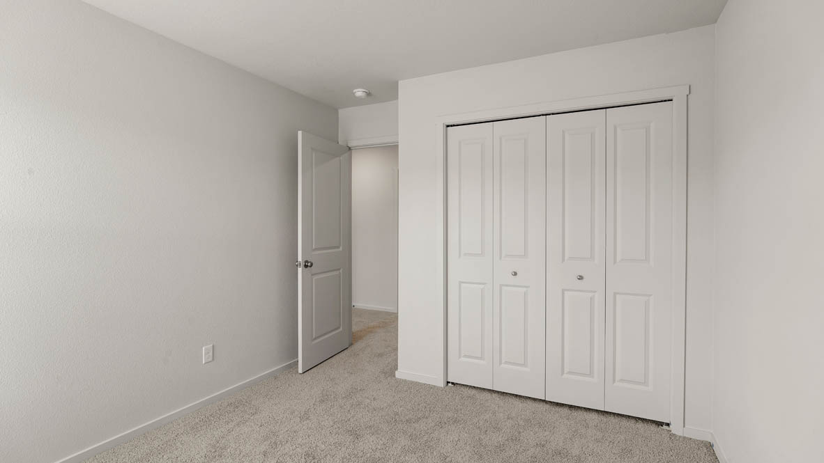 Addysen Park bedroom with white walls, carpet