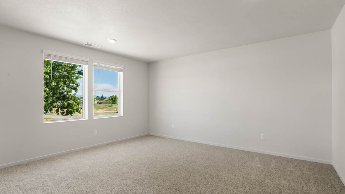 Addysen Park Primary Bedroom with carpet, white walls, and window