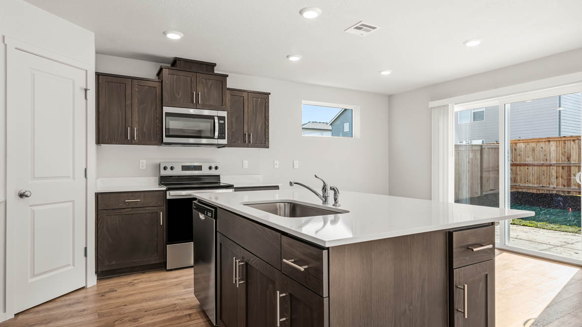 Addysen Park Kitchen with flooring, stainless steel appliances, quartz countertops
