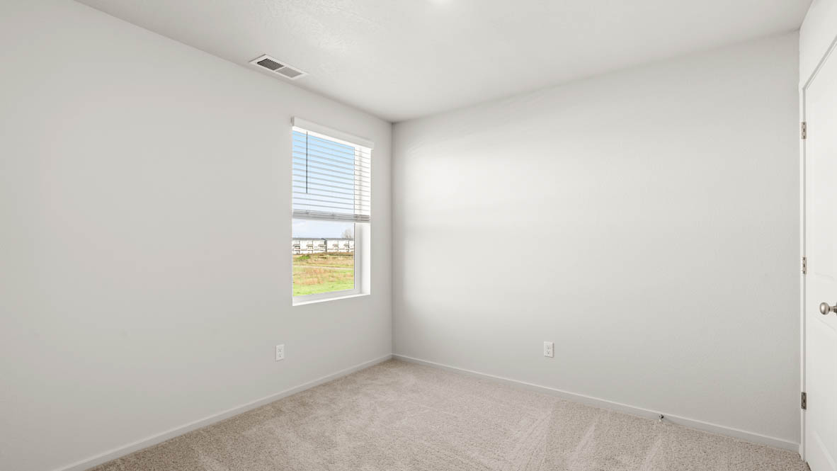 Addysen Park Bedroom with carpet, white walls, and window