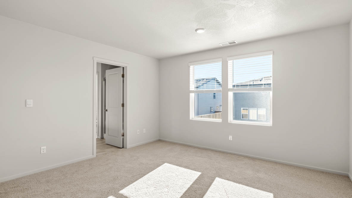 Addysen Park Primary Bedroom with carpet, white walls, and window