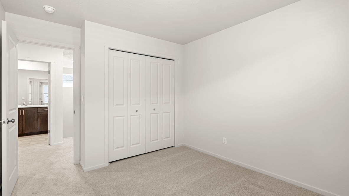 Addysen Park bedroom with white walls, carpet
