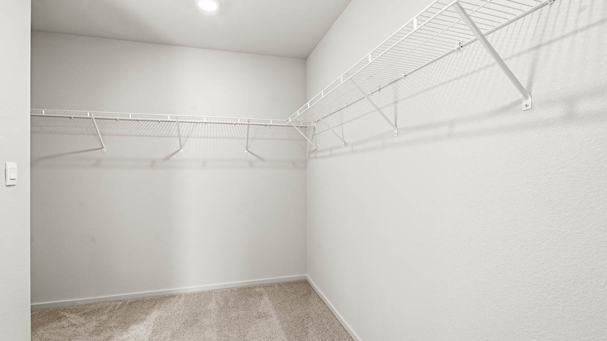 Addysen Park walk in closet with white wire shelving