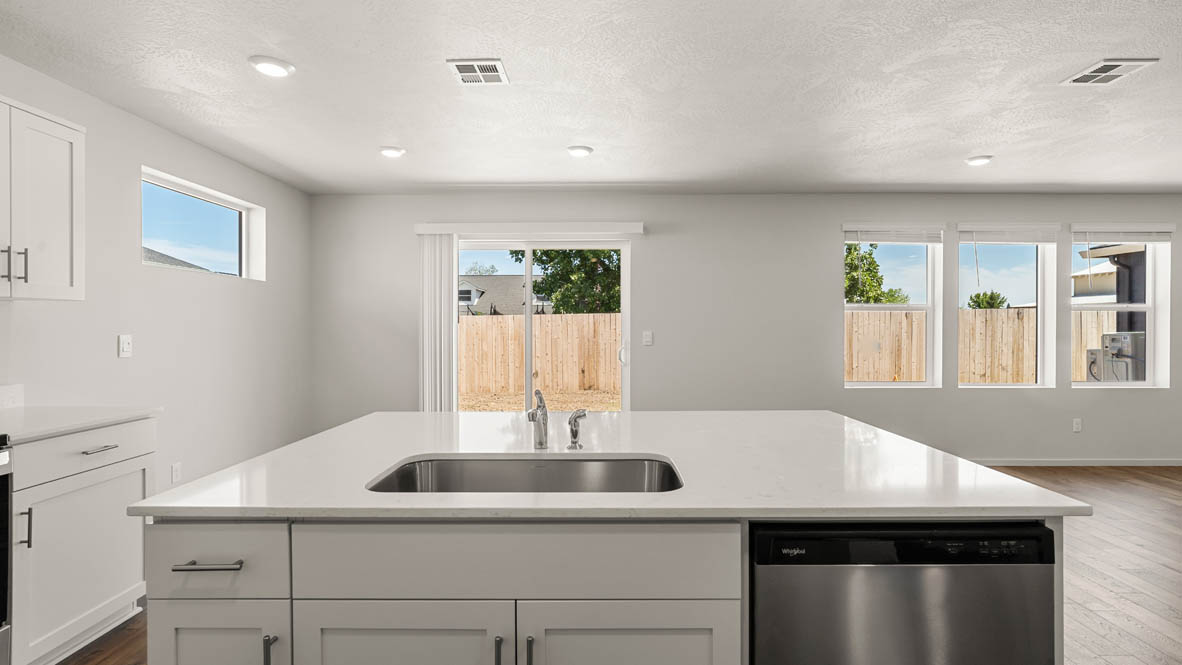 Addysen Park Kitchen with flooring, stainless steel appliances, quartz countertops