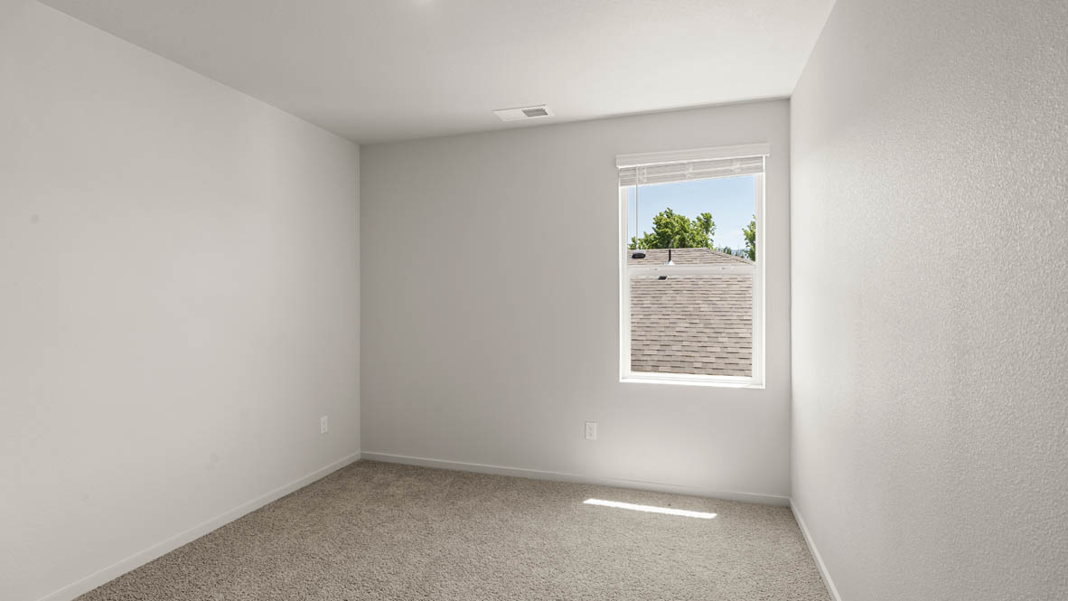 Addysen Park Bedroom with carpet, white walls, and window