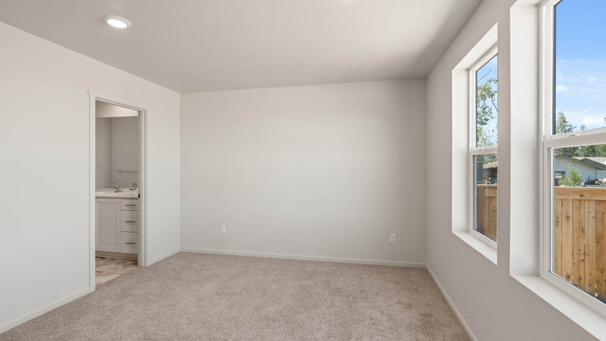 Addysen Park Primary Bedroom with carpet, white walls, and window