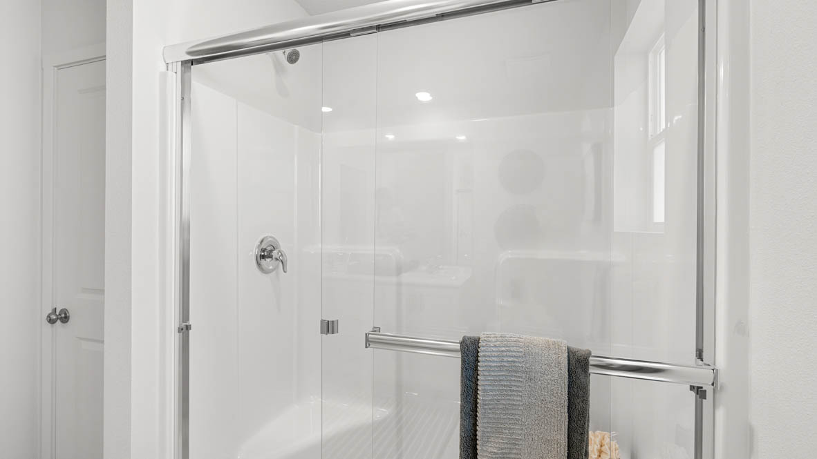 addysen park primary bathroom with walk in shower with chrome accents