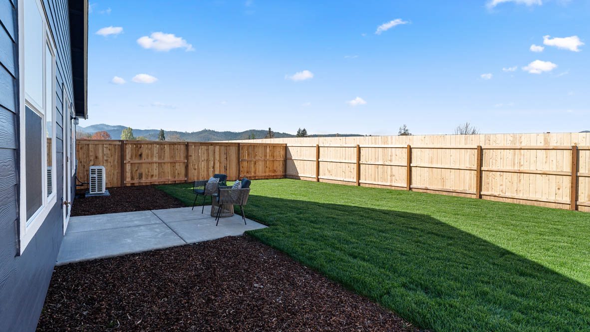 addysen park backyard with wood fencing and grass