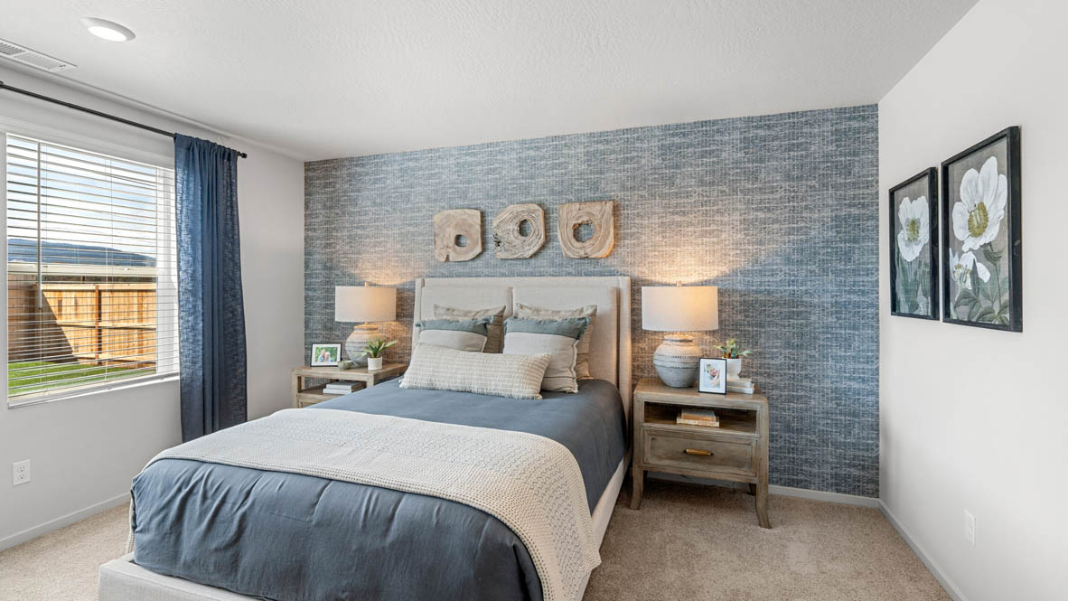 Addysen Park Primary bedroom with carpet, bedroom with pillows, dresser, circle mirror, windows, nightstand with lamp