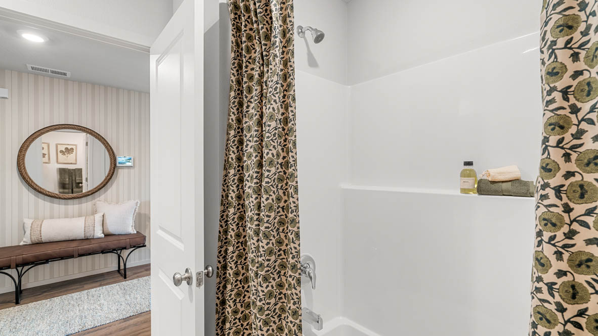 Addysen Park secondary bathroom with shower tub, shower curtain