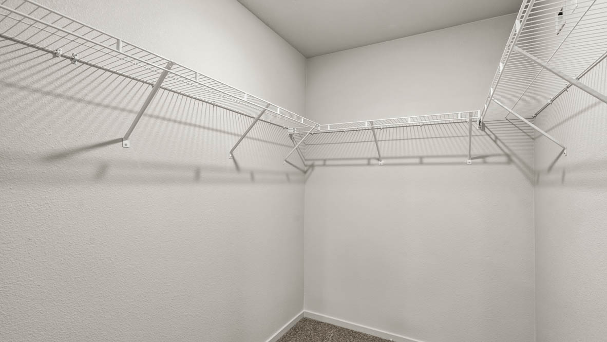 Addysen Park walk in closet with white wire shelving