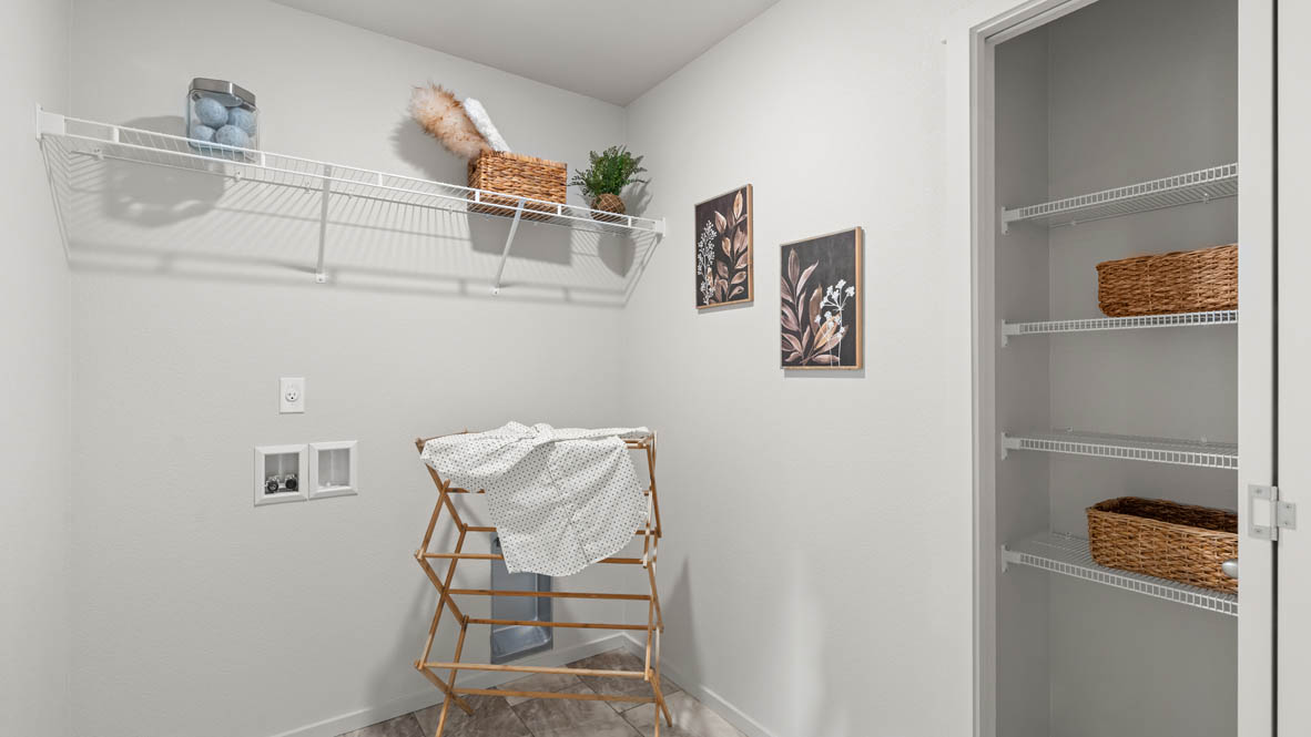 Addysen Park laundry room with white wire shelving