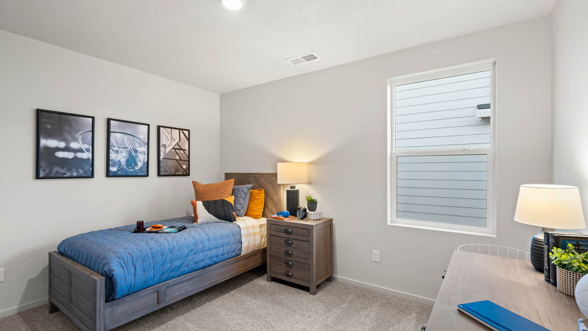 Addysen Park bedroom with carpet, bedroom with pillows, dresser, circle mirror, windows, nightstand with lamp