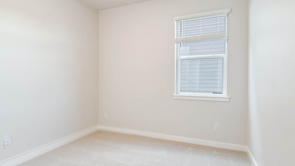 Avery Terrace Bedroom with carpet, white walls, and a window
