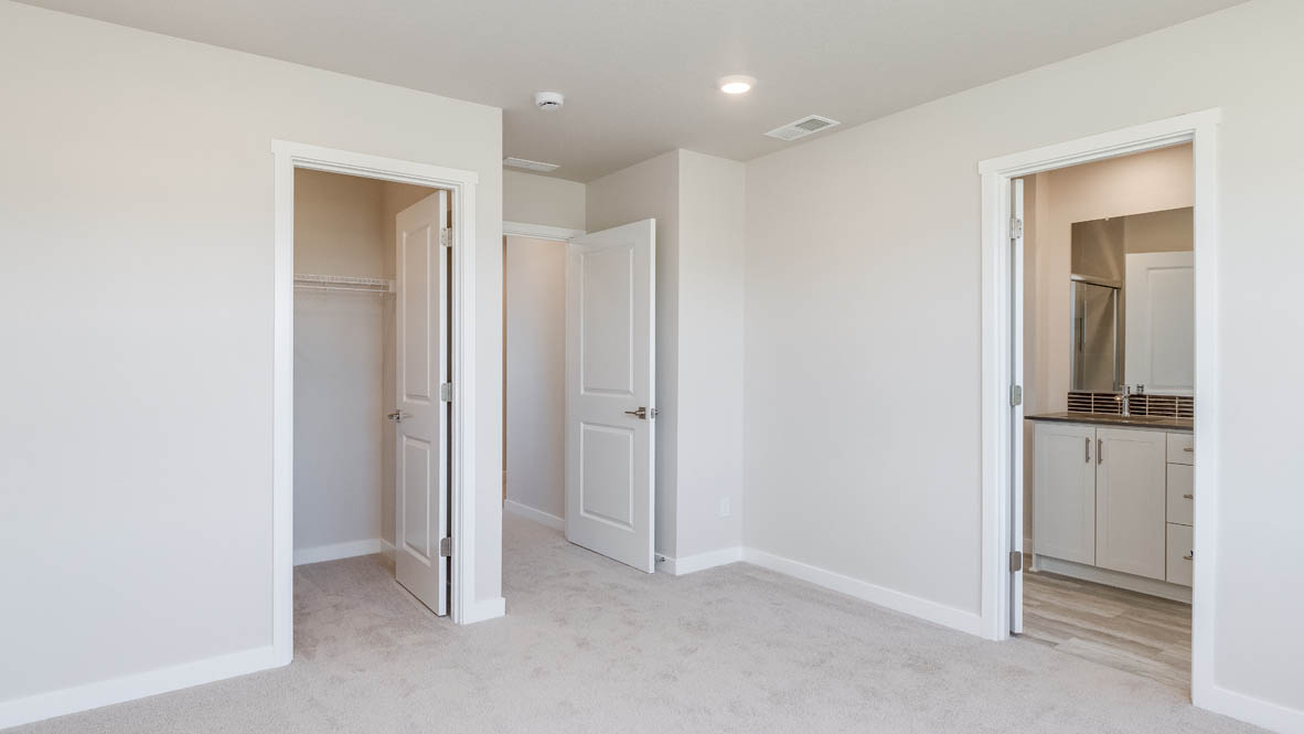 Avery Terrace Primary bedroom with carpet, white walls, closet, and the en suite bathroom