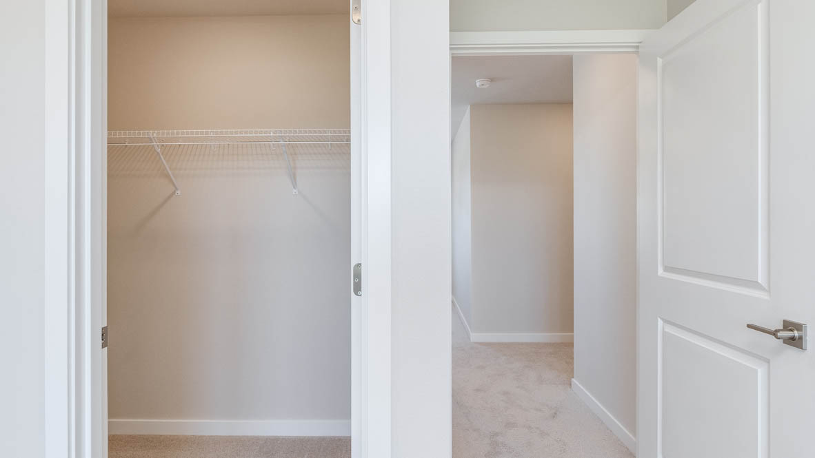 Avery Terrace Primary bedroom with a walk in closet and the door to the hallway