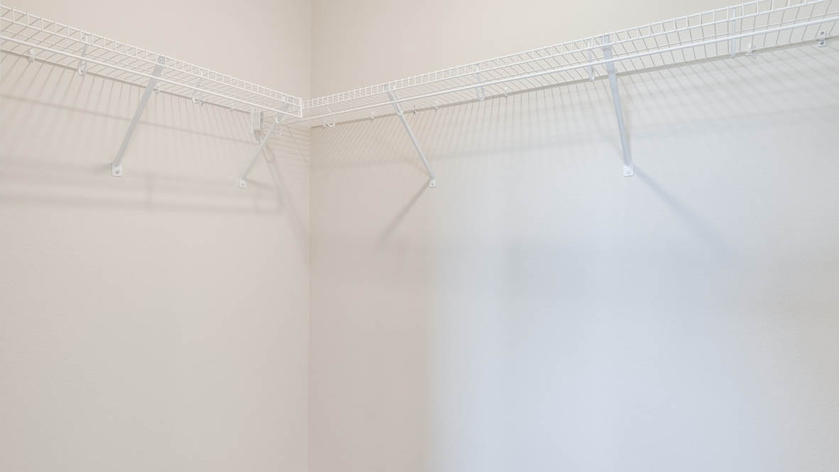 Avery Terrace Walk In Closet with white wire shelving