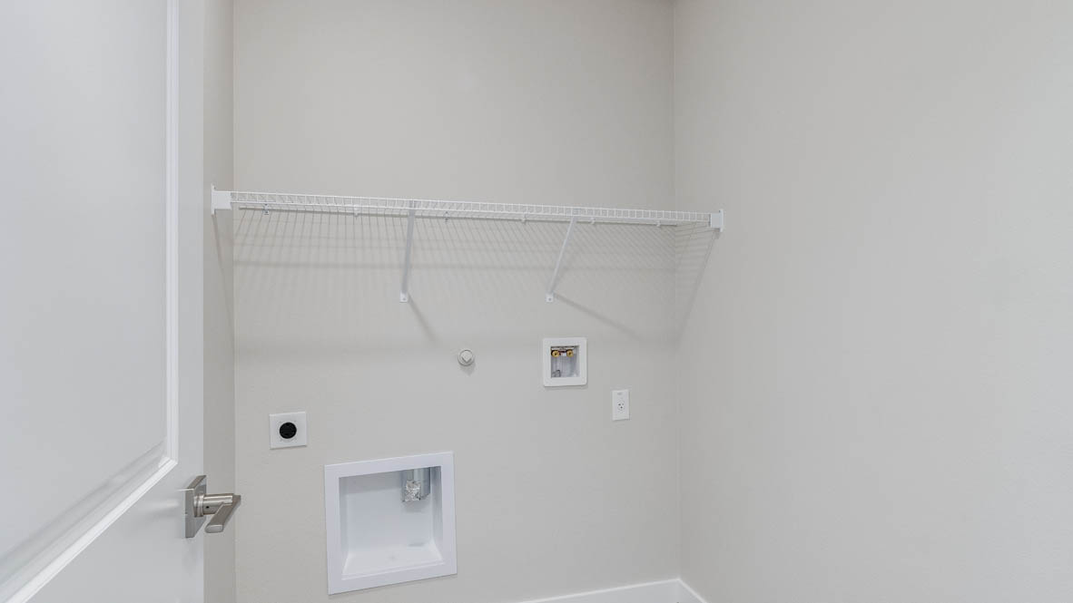 Avery Terrace laundry room with white wire shelving
