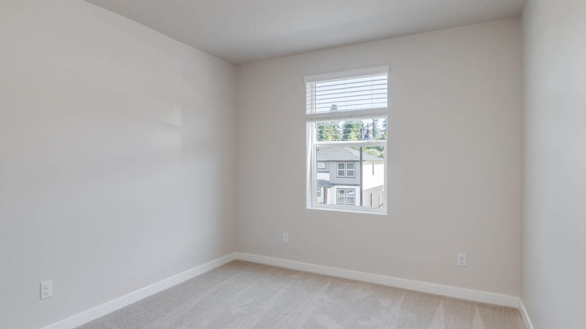 Avery Terrace Bedroom with carpet, white walls, and a window