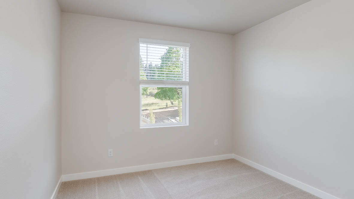 Avery Terrace Bedroom with carpet, white walls, and a window