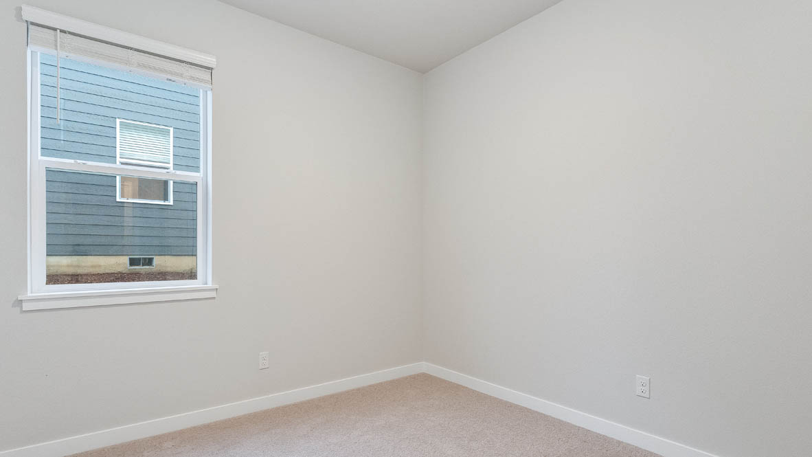 Avery Terrace Bedroom with carpet, white walls, and a window