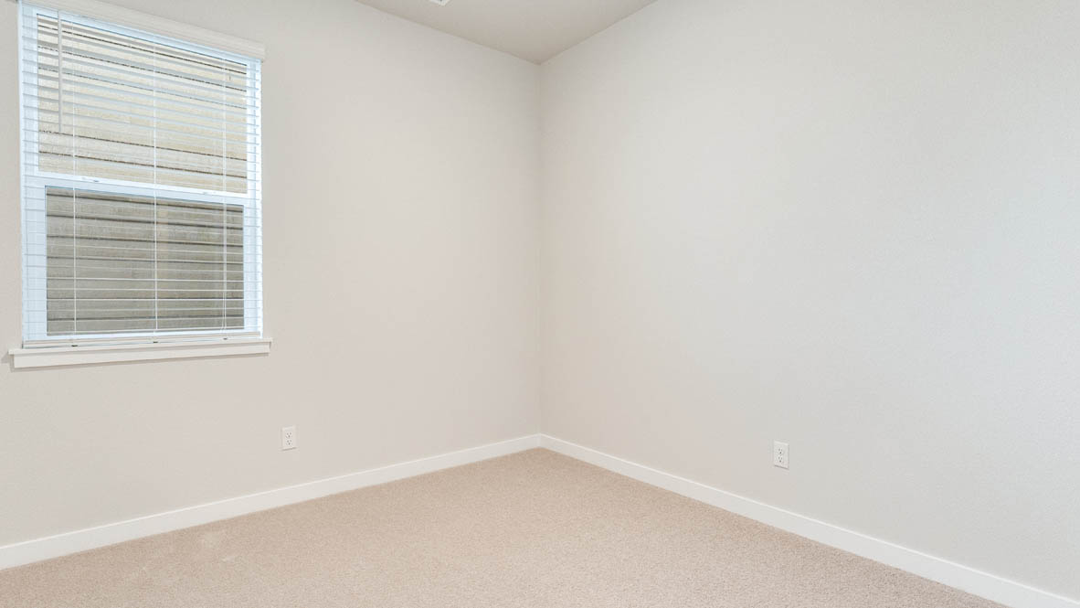 Avery Terrace Bedroom with carpet, white walls, and a window