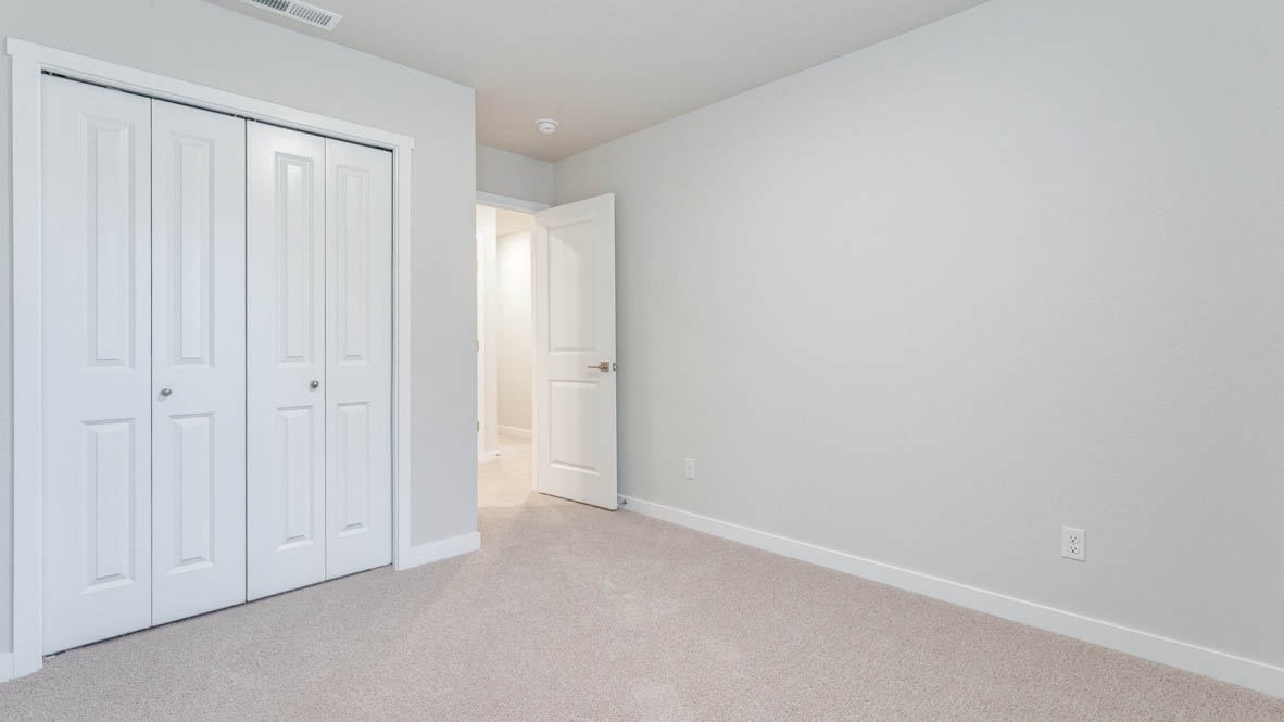 Avery Terrace bedroom with carpet, windows, and white walls