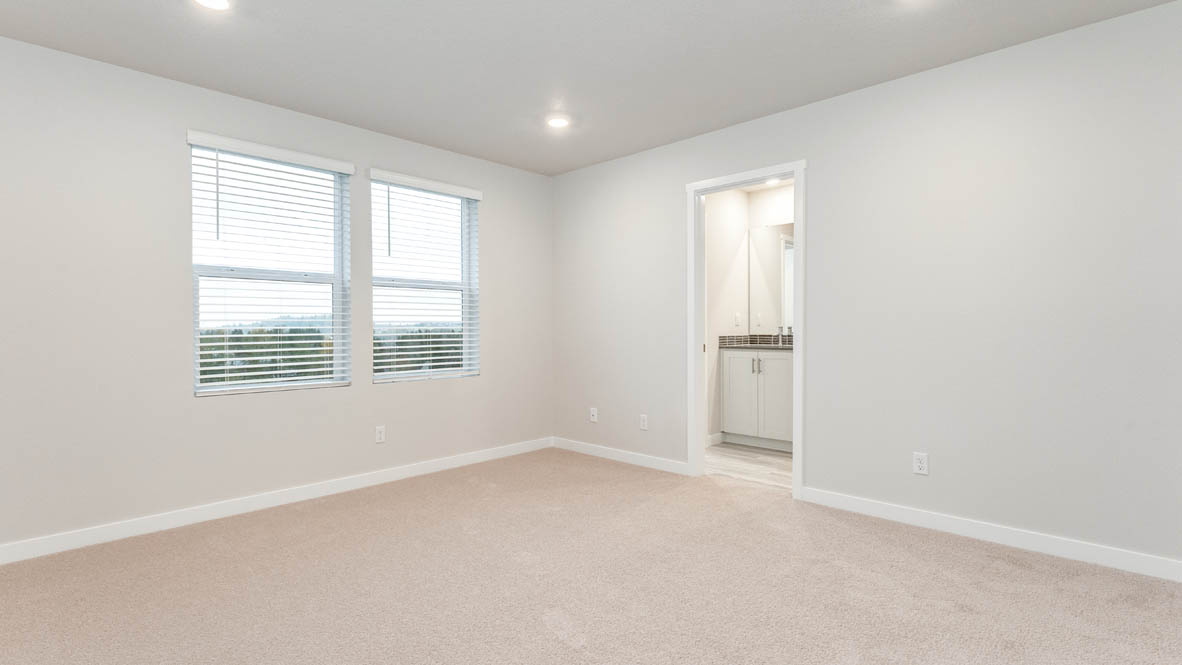 Avery Terrace primary bedroom with carpet, windows, and white walls
