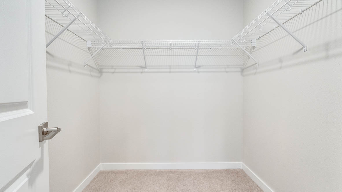 Avery Terrace Walk In Closet with white wire shelving