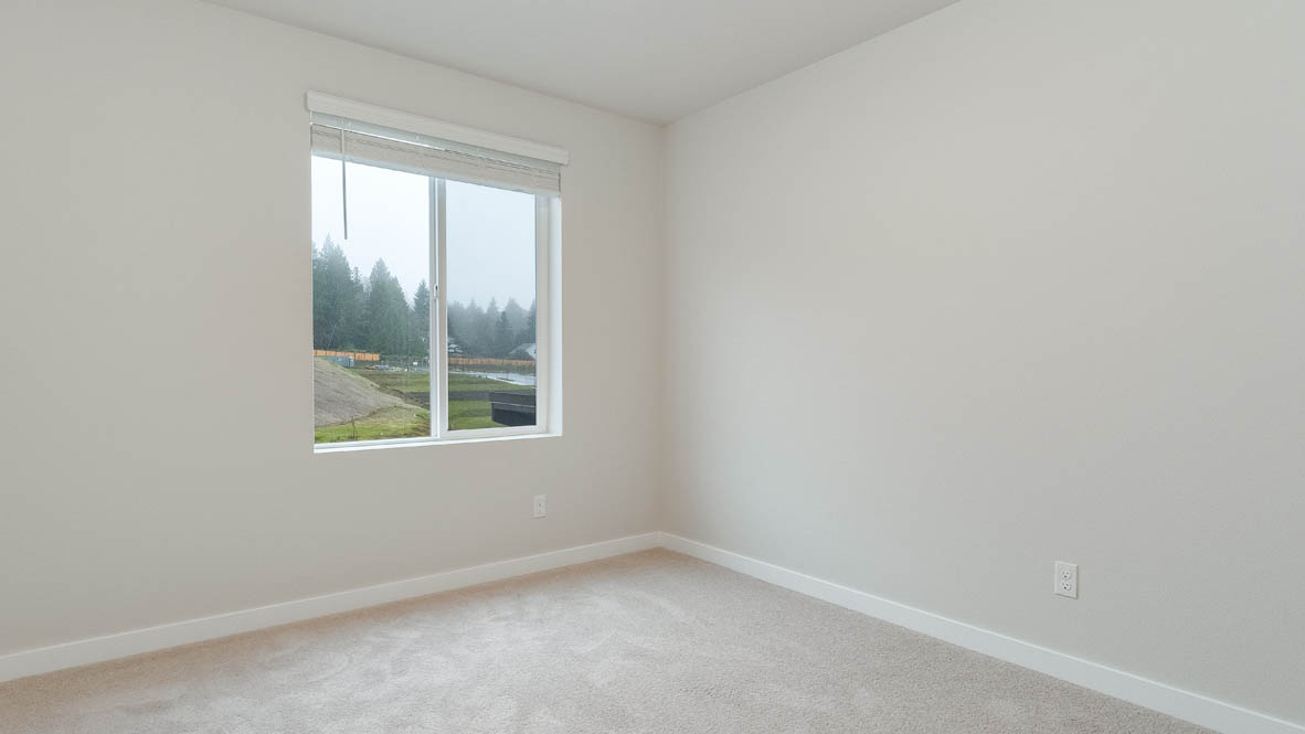 Avery Terrace bedroom with carpet, windows, and white walls