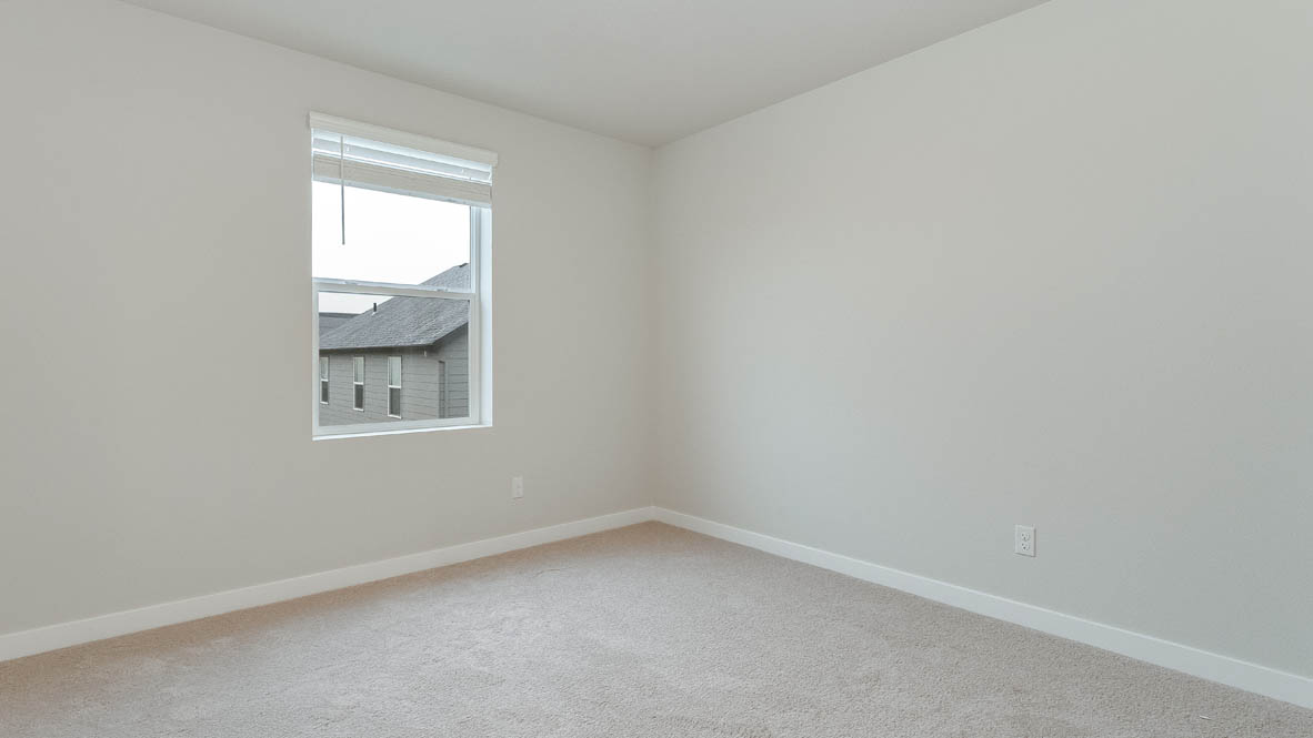 Avery Terrace bedroom with carpet, windows, and white walls