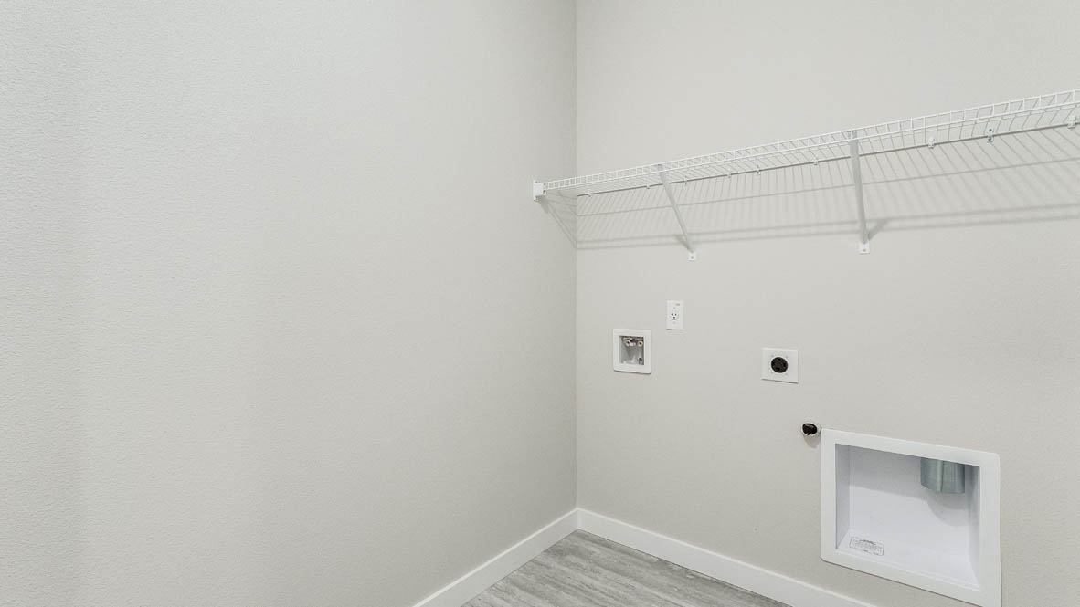 Avery Terrace laundry room with white wire shelving