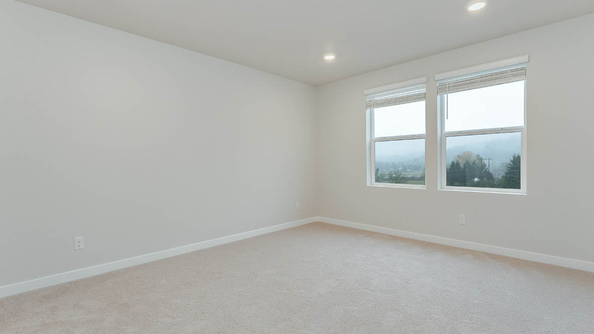 Avery Terrace primary bedroom with carpet, windows, and white walls