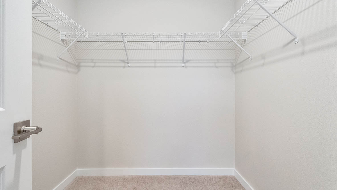 Avery Terrace Walk In Closet with white wire shelving