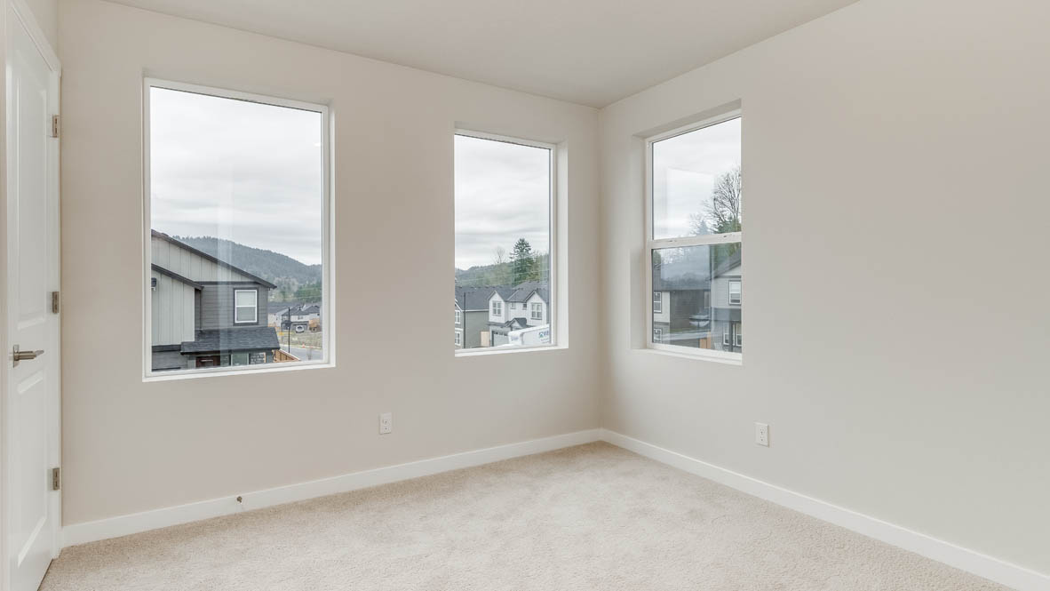 Bedroom with wall-to-wall carpet and a closet