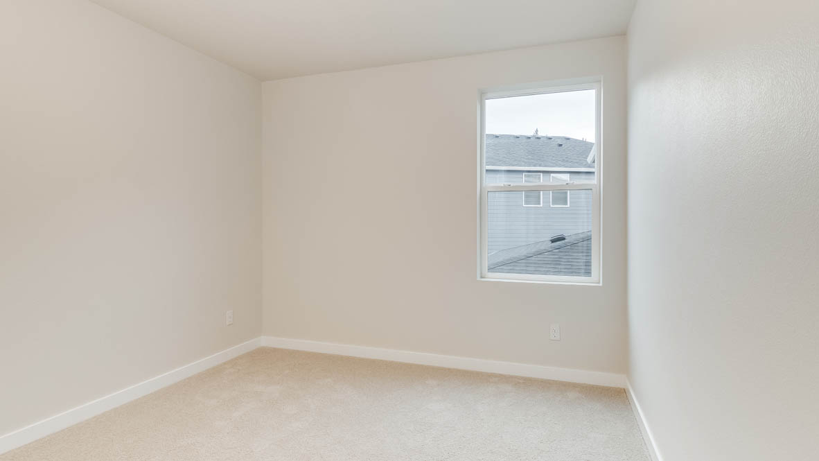 Bedroom with wall-to-wall carpet and a closet