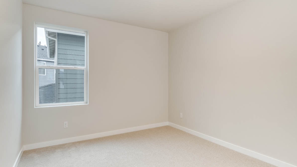 Bedroom with wall-to-wall carpet and a closet