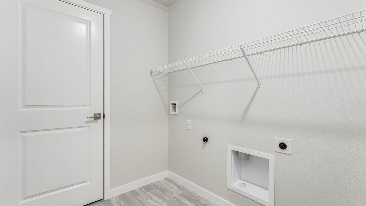Avery Terrace laundry room with white wire shelving