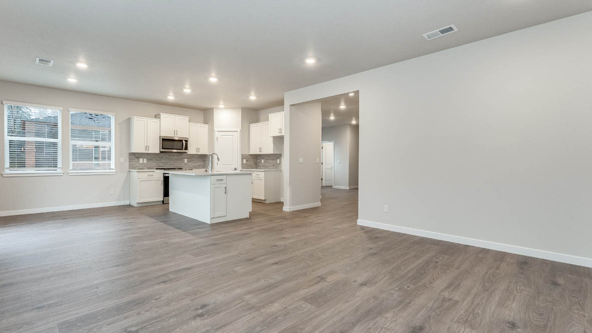 Great room with laminate flooring and an electric fireplace