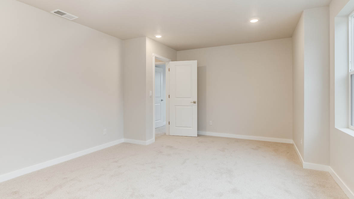 Avery Terrace bonus room with carpet, ceiling lights, and walls